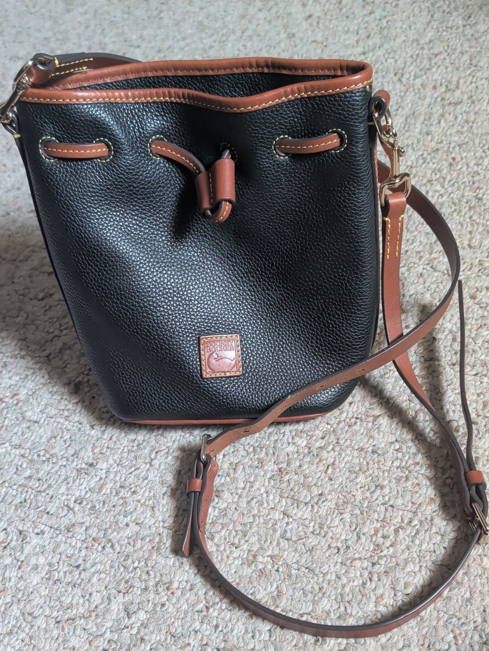 Dooney & Bourke Black Pebble Leather Drawstring Bucket Bag with Brown Trim